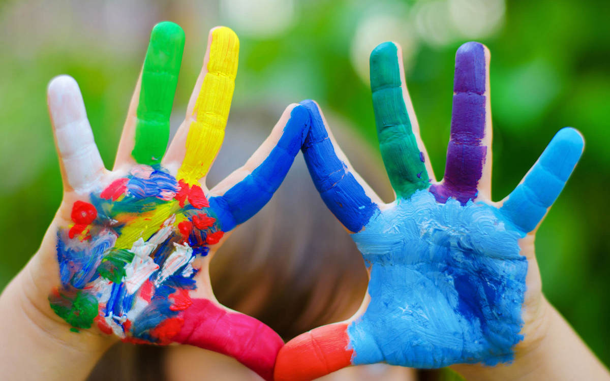 Pupils-learning hands covered in coloured paint