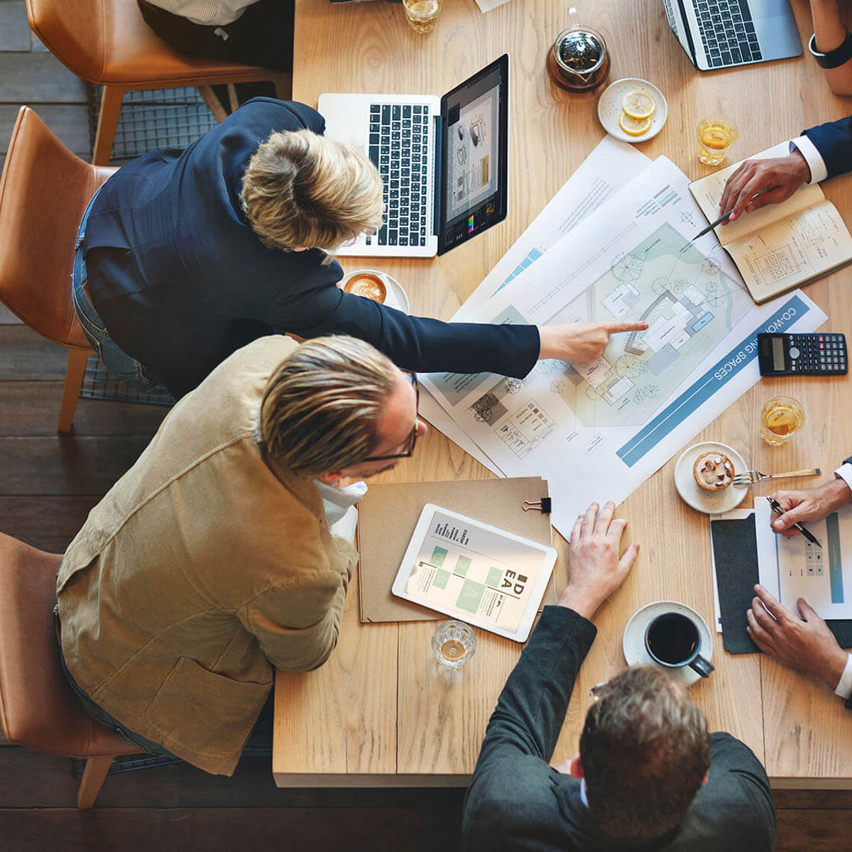 People discussing paperwork at a meeting