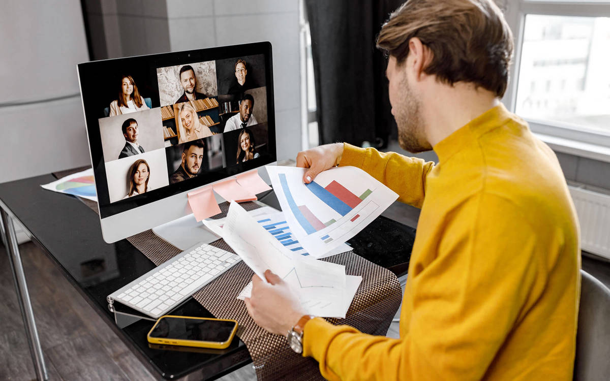 tools-resources someone in a video call with nine others checking over graphs