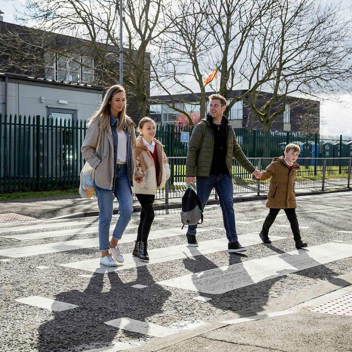school-environment family using zebra crossing