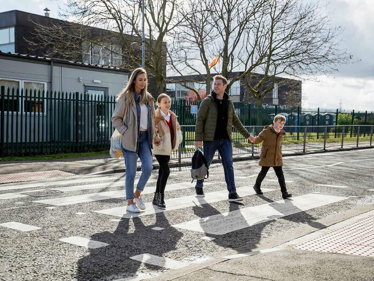 school-environment family using zebra crossing