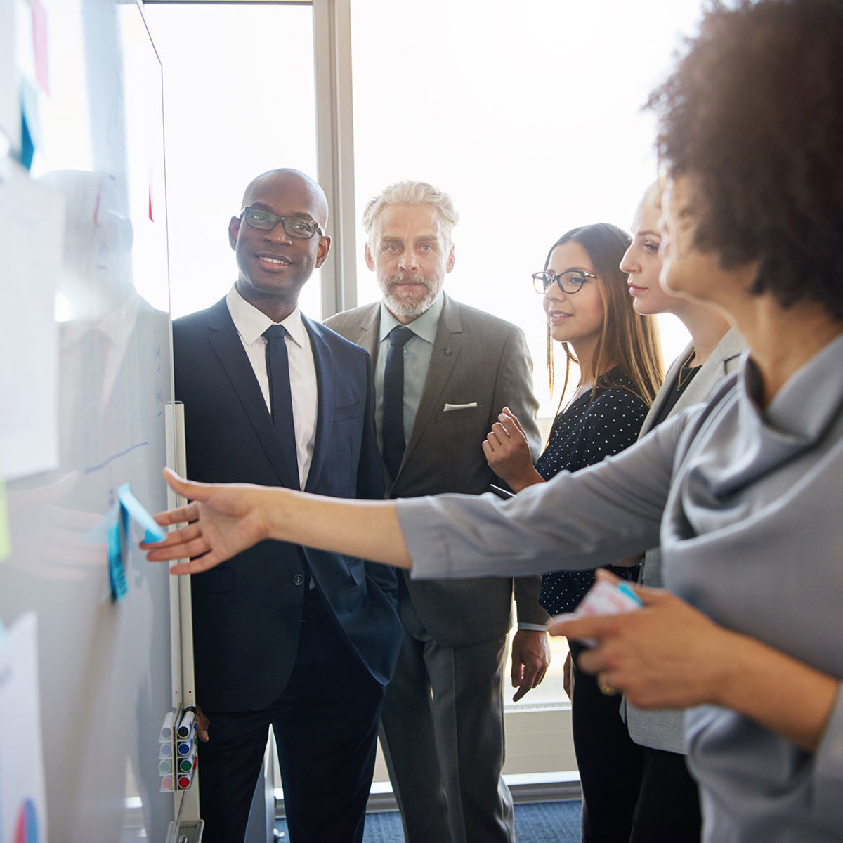 training crowd interacting with whiteboard 