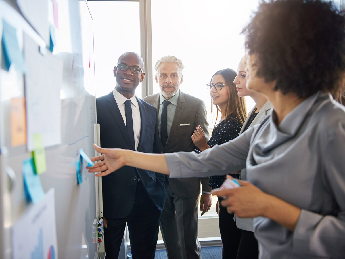 training crowd interacting with whiteboard