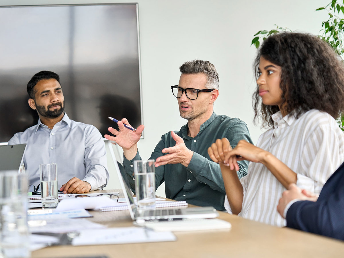 training small group around table in discussion