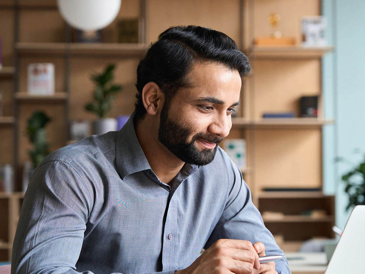 people man smiling at his laptop