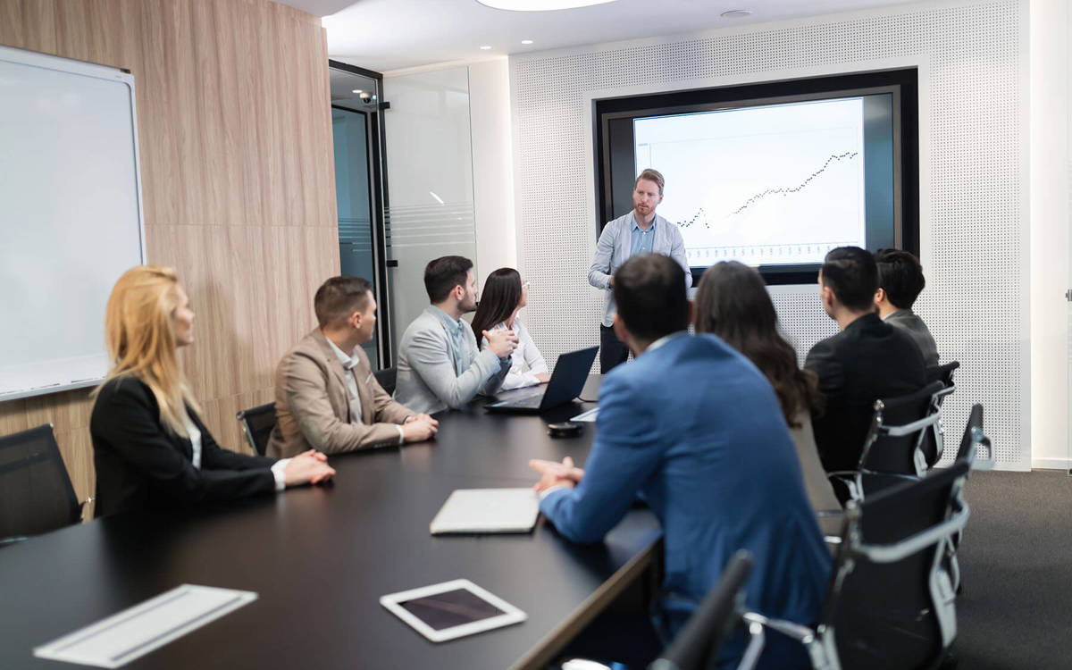people in a board room meeting
