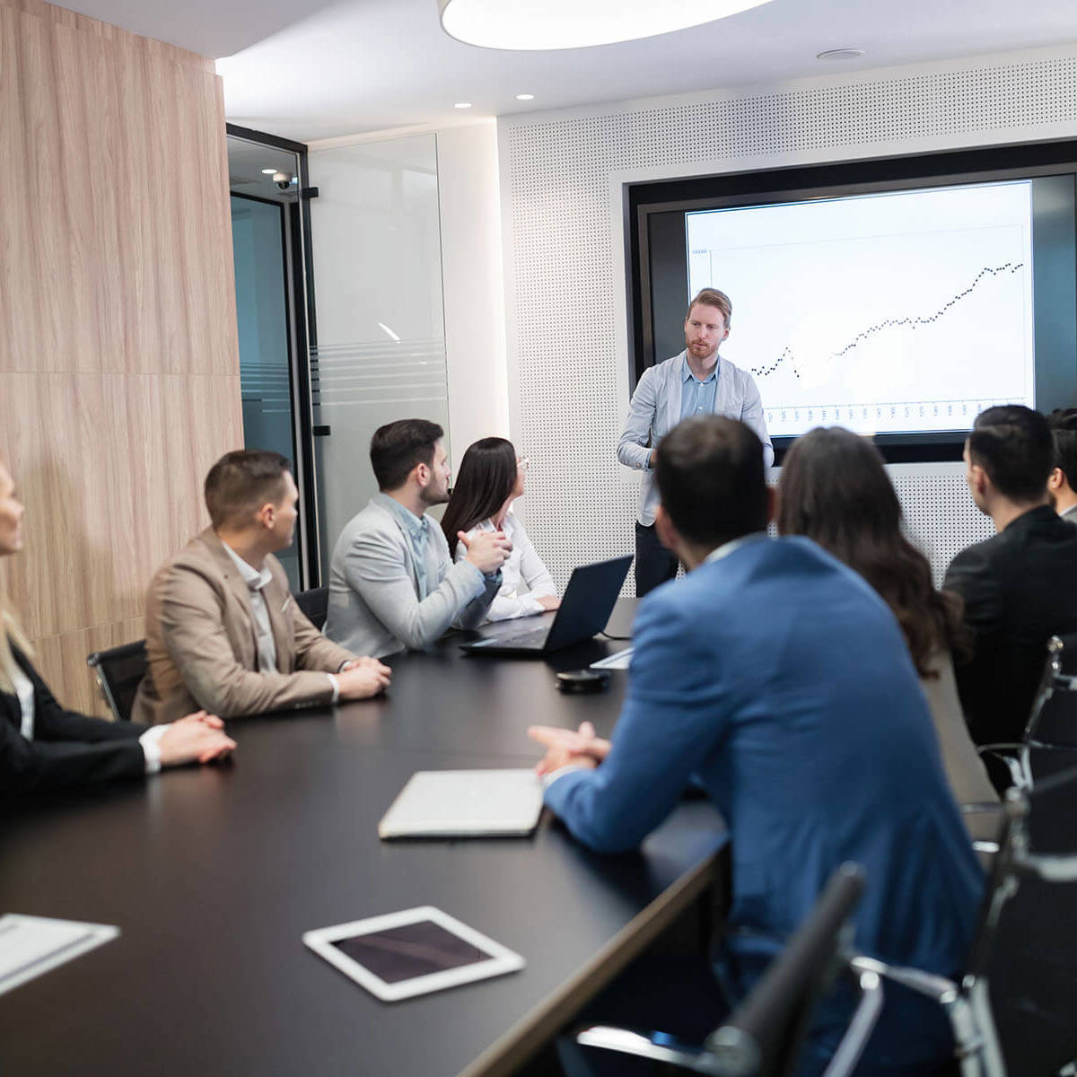 people in a board room meeting