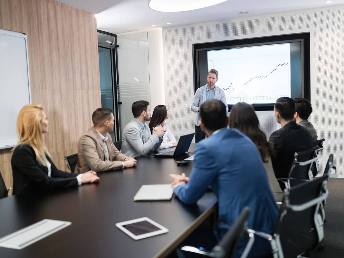 people in a board room meeting