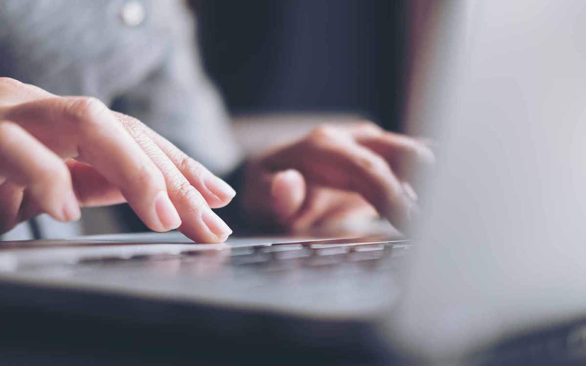 tools-resources someone typing on a laptop