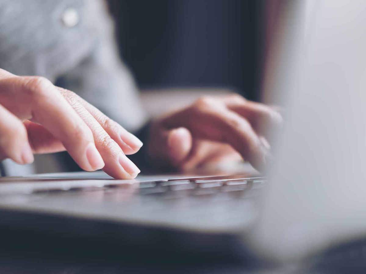 tools-resources someone typing on a laptop