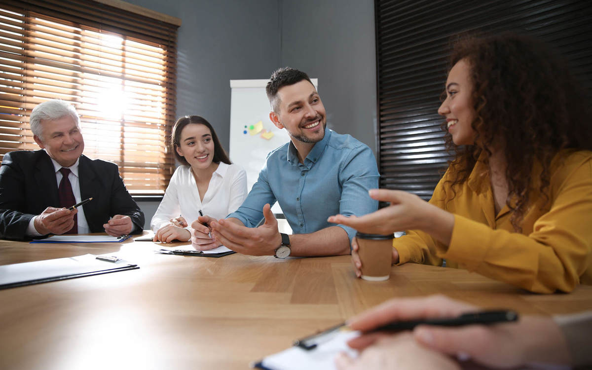 People having a conversation during a meeting