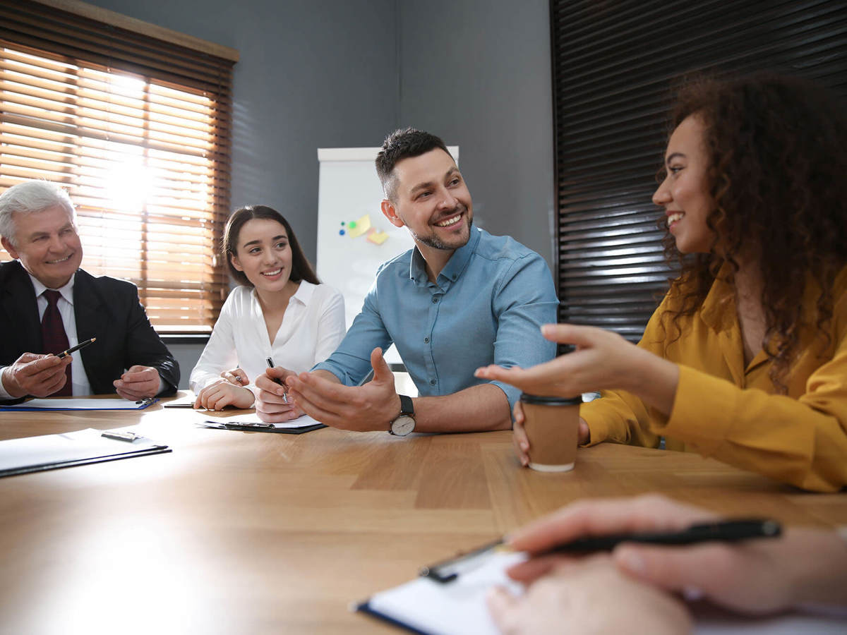 People having a conversation during a meeting