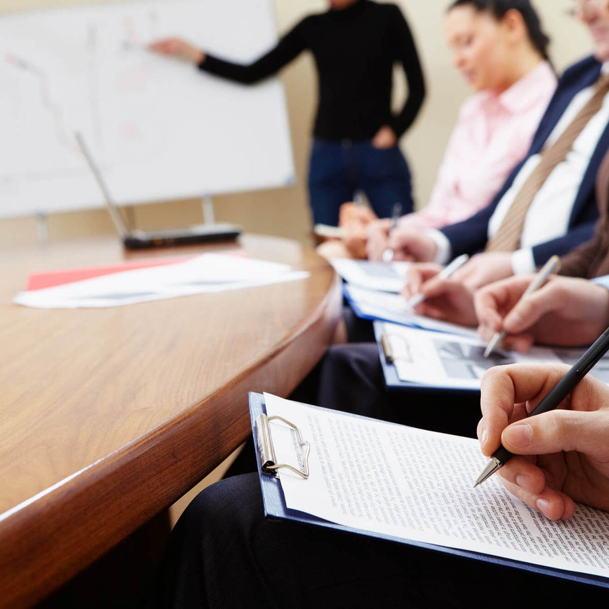 training small class taking notes from whiteboard