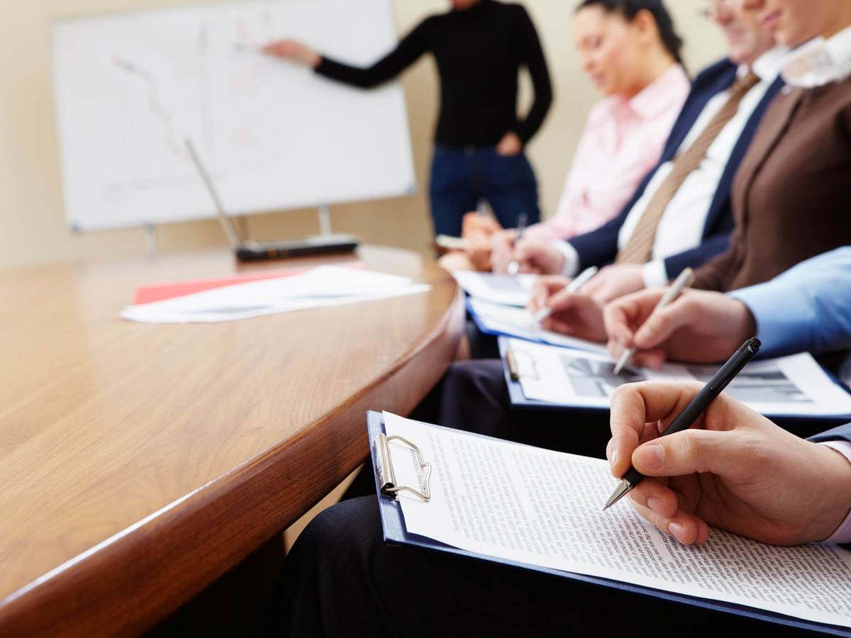 training small class taking notes from whiteboard