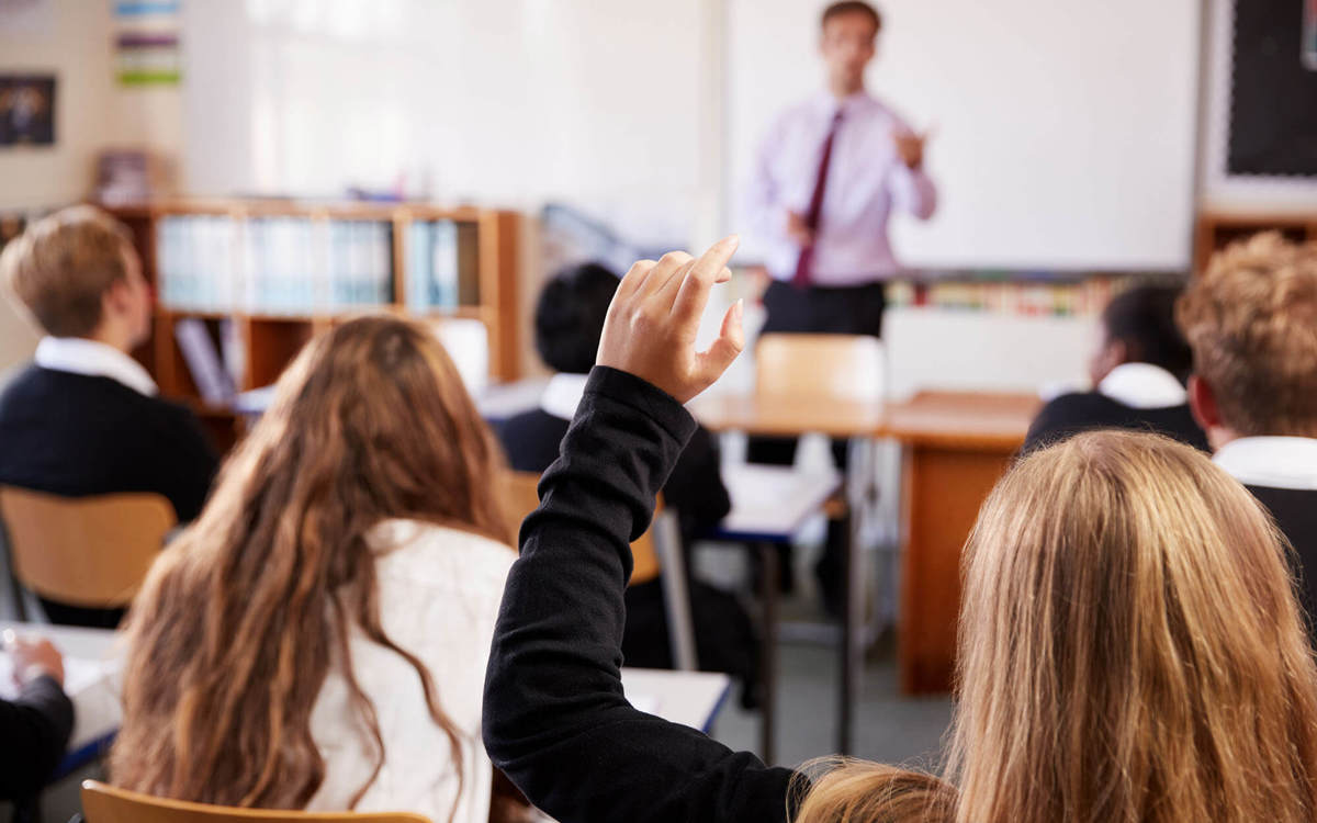 school-environment pupil raising hand in class