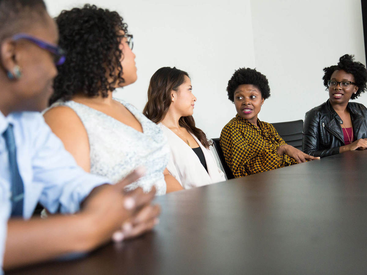 Line of people talking holding a meeting