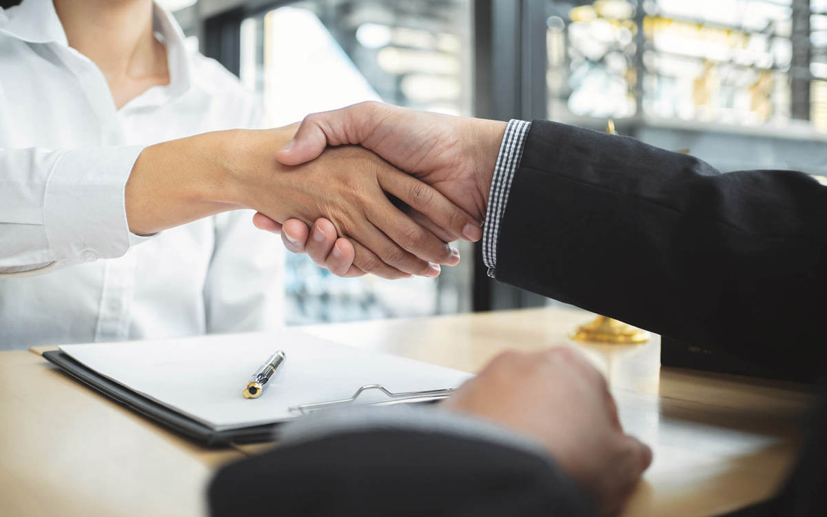 two people shaking hands
