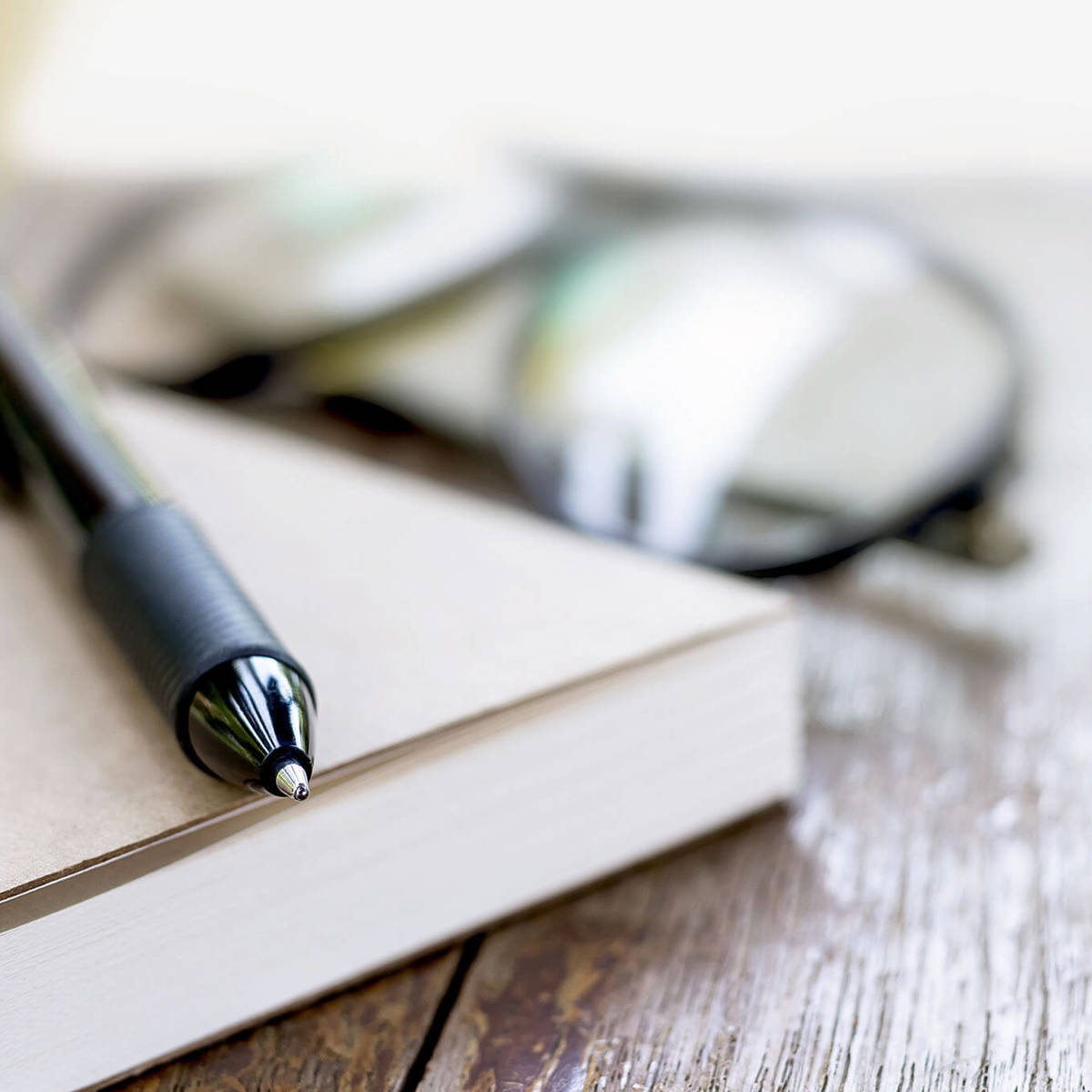 tools-resources blurred background image of a pen on a book