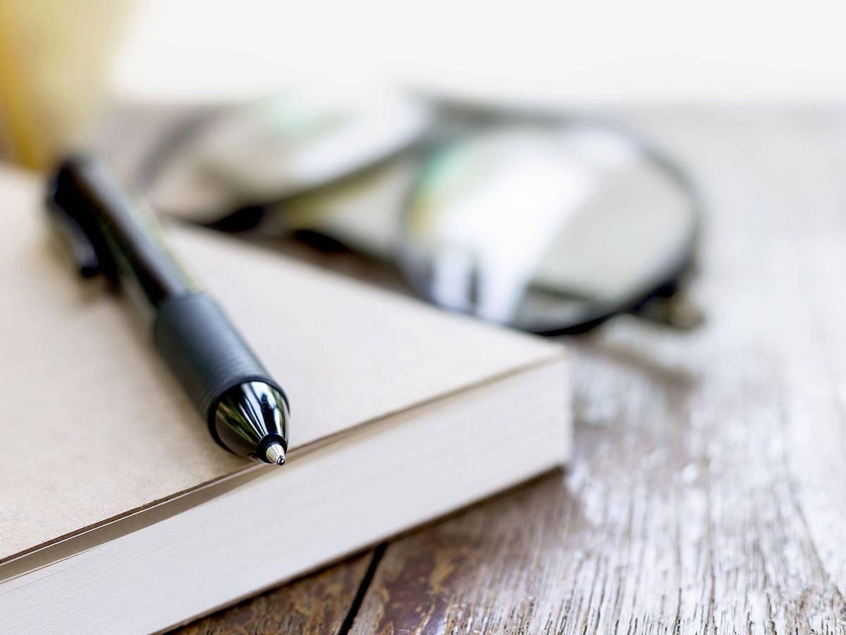 tools-resources blurred background image of a pen on a book