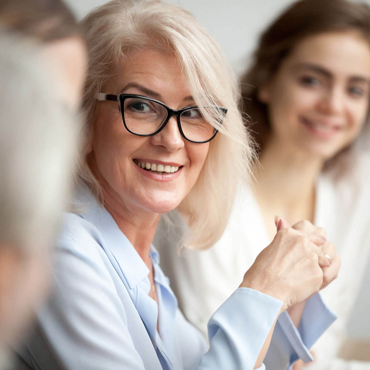 Lady smiling in meeting