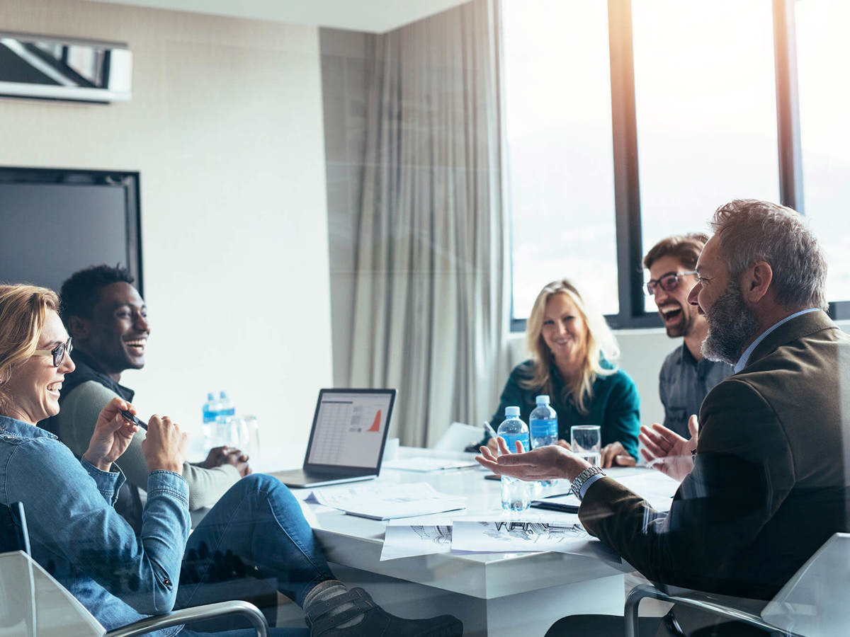 people laughing in a meeting