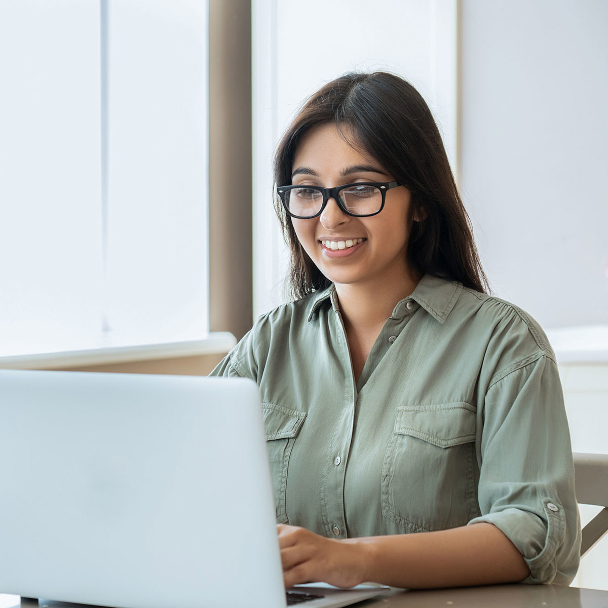 training woman on laptop smiling