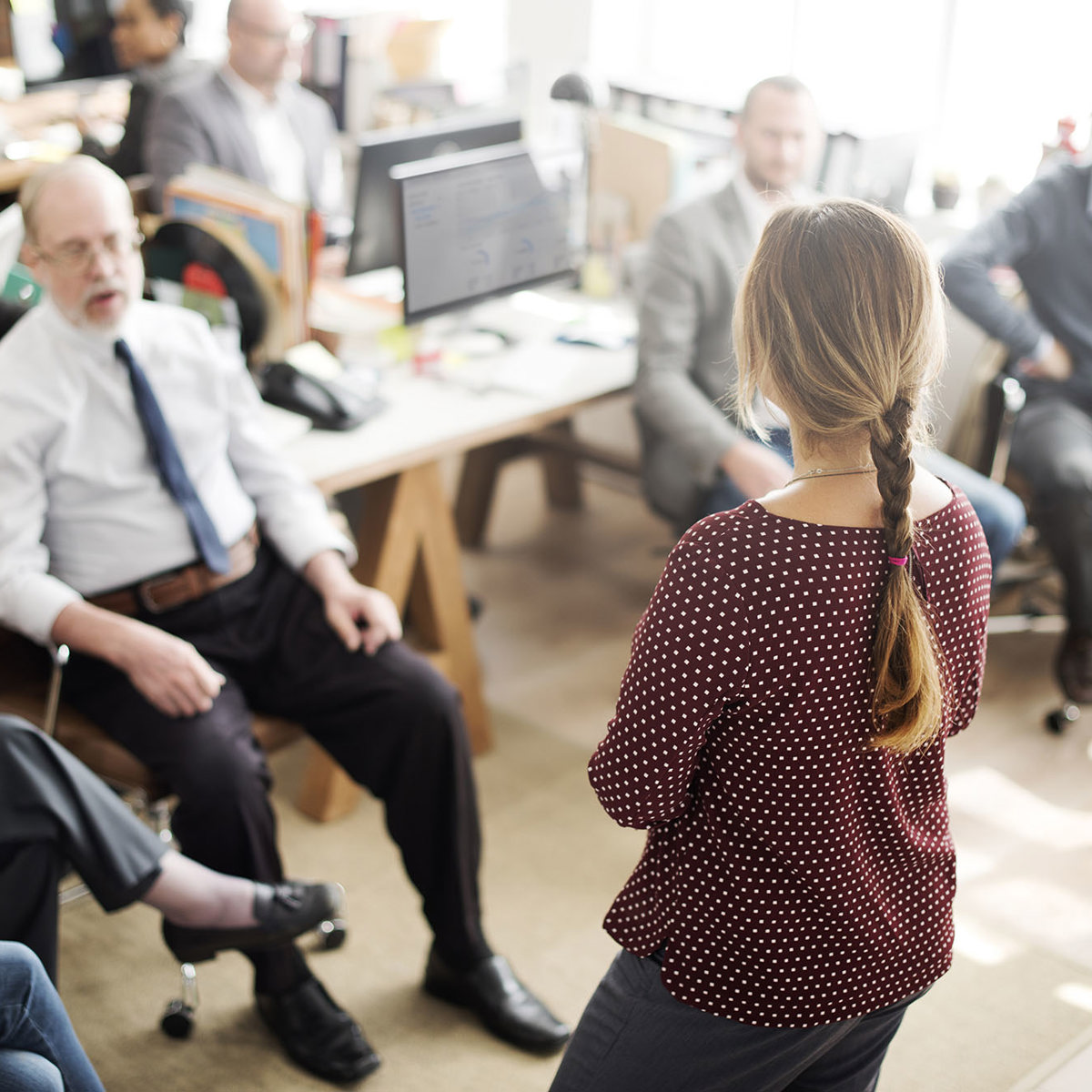 training woman presenting to a large class