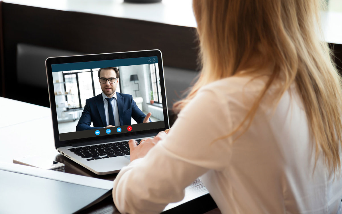 training woman in a one to one video call