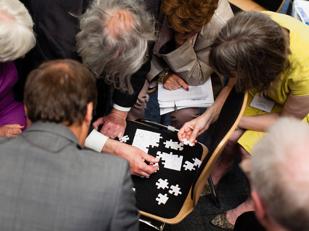 people solving a puzzle together