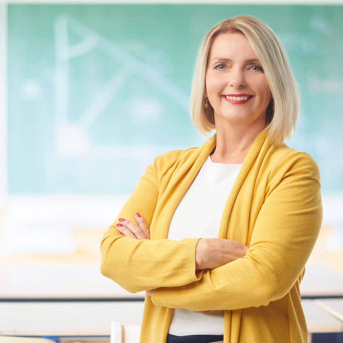 people woman smiling into the camera in a classroom