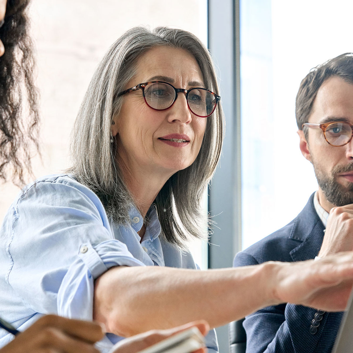 training three people taking notes from same laptop