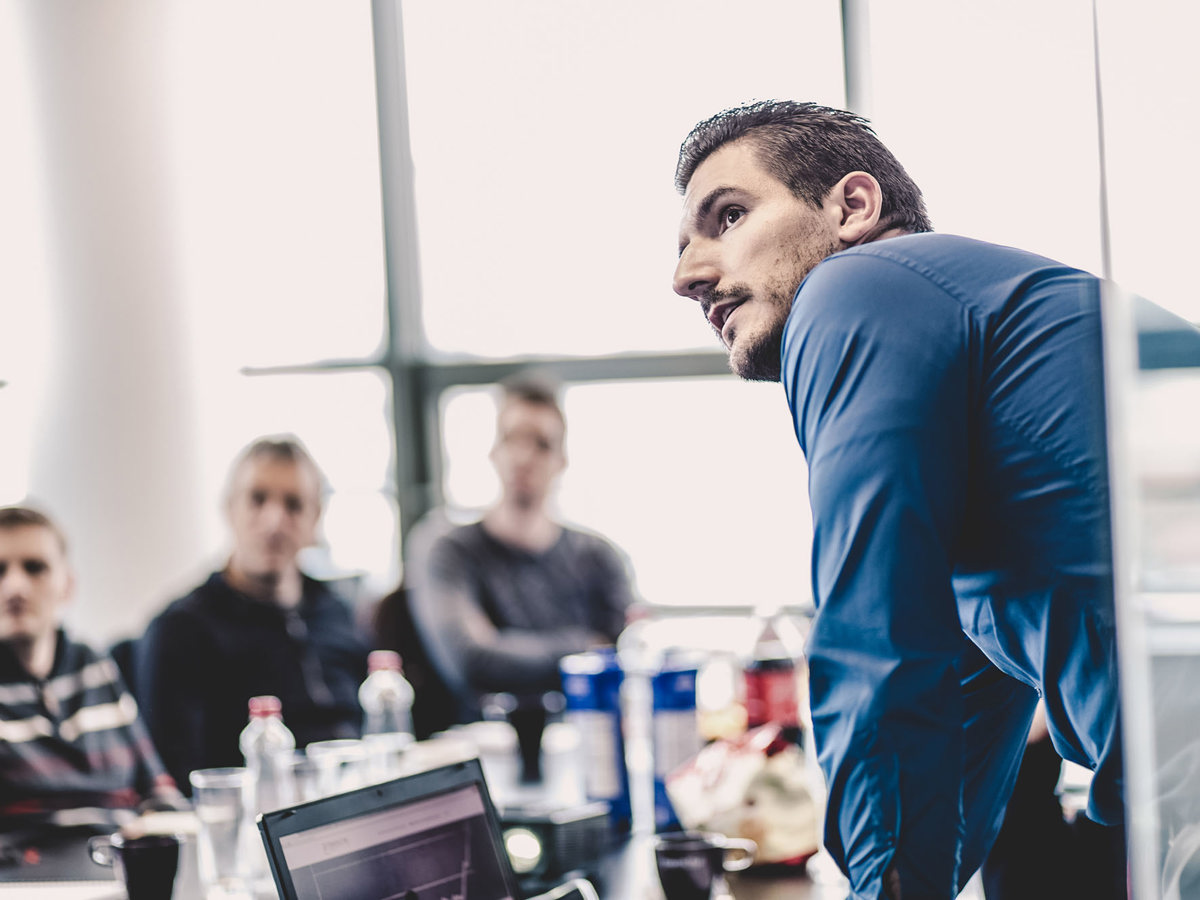 training people looking in same direction at table